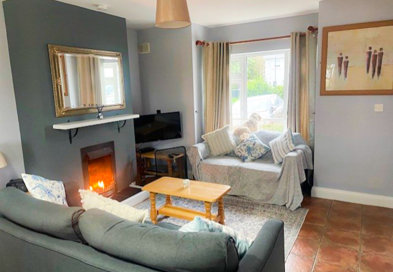 Seacliff Holiday Home No. 2, Dunmore East, County Waterford. Open fire, cosy living room.