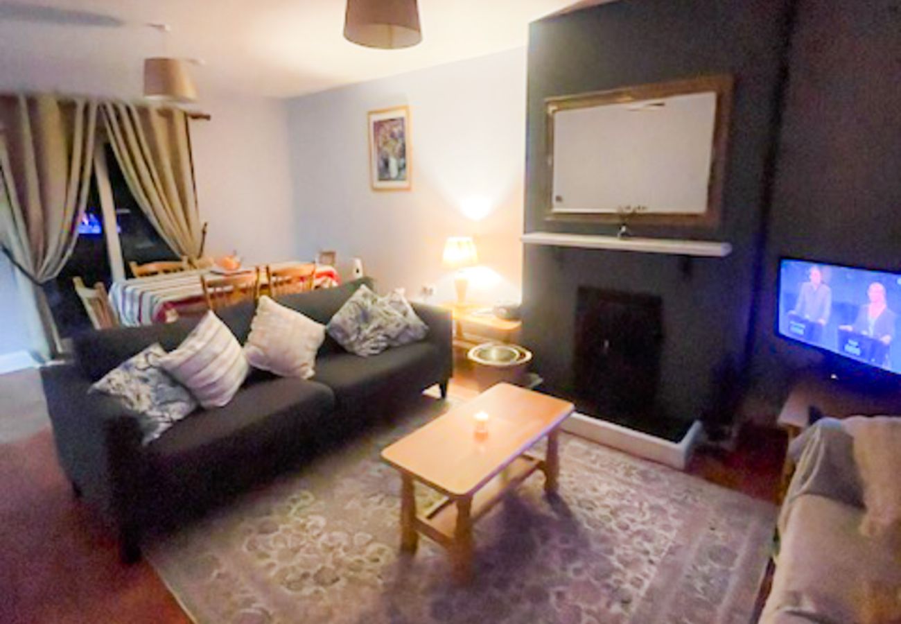 Seacliff Holiday Home No. 2, Dunmore East, County Waterford. Living room, open fire, large TV comfortable seating.