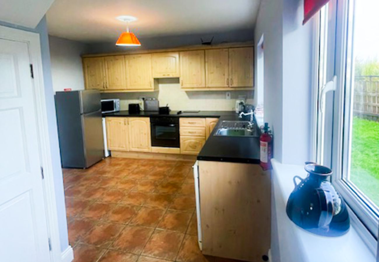 Seacliff Holiday Home No. 2, Dunmore East, County Waterford. Modern  pine kitchen, tiled floors.