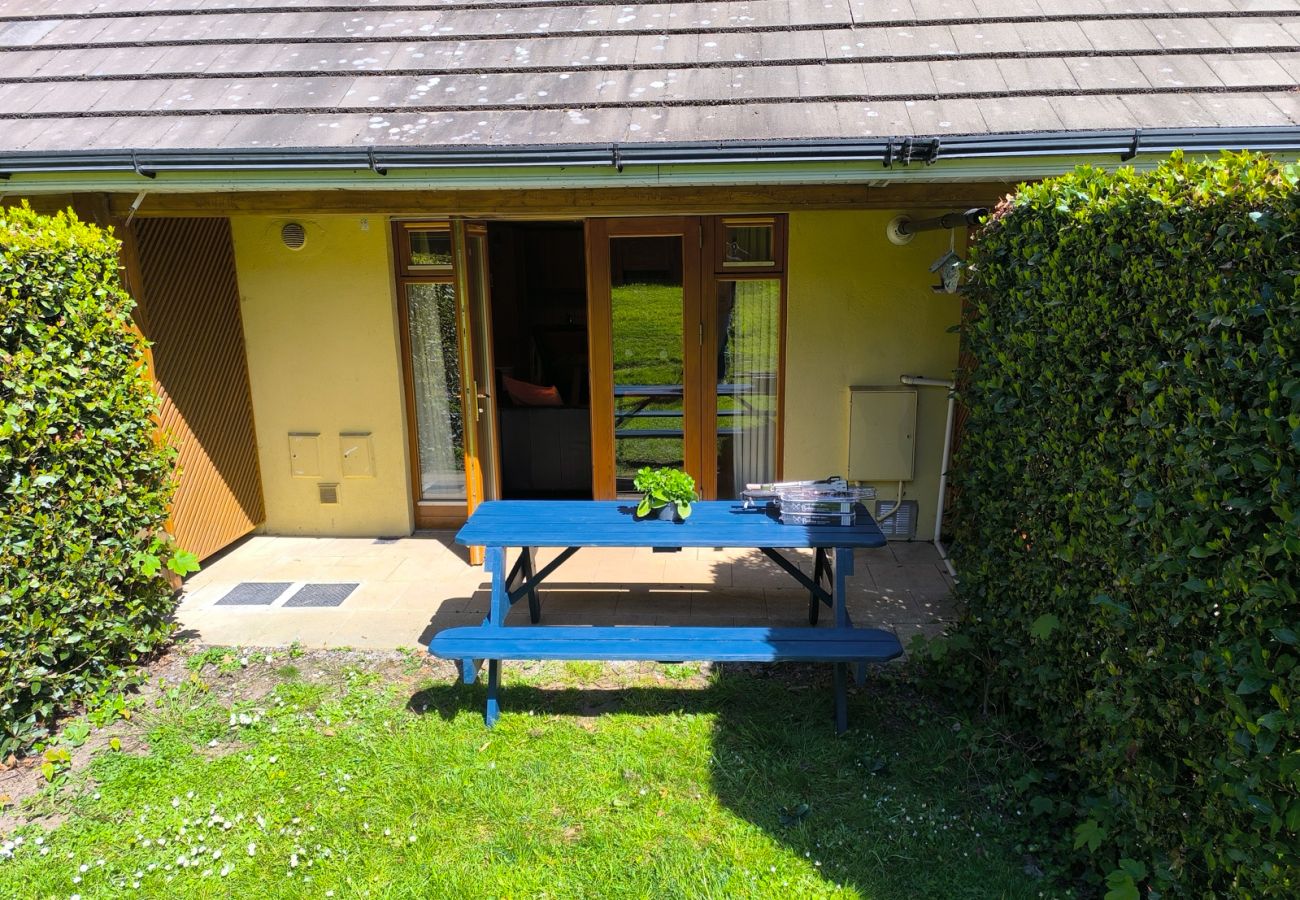 Heyward Mews Holiday Homes. Patio access to private sunny garden. Garden table and bench. 