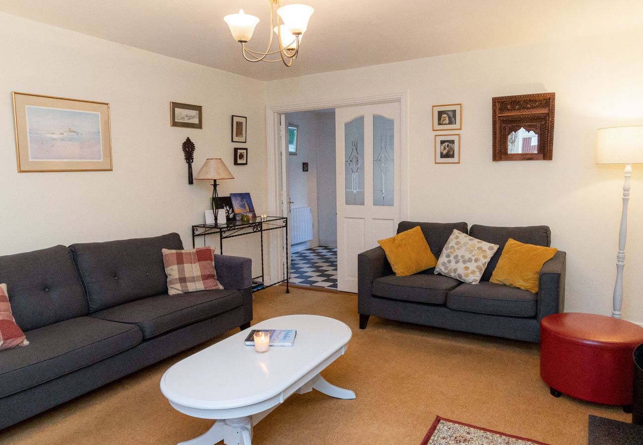 Aughrim Holiday Village No. 14. Aughrim holiday village. Living room, modern comfortable sofas, coffee table. 