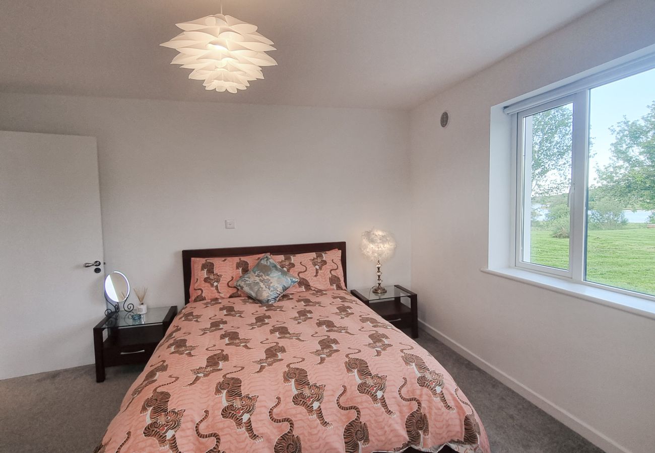 Riverrun Holiday Home No 15. King size ensuite bedroom, ground floor view to garden. 