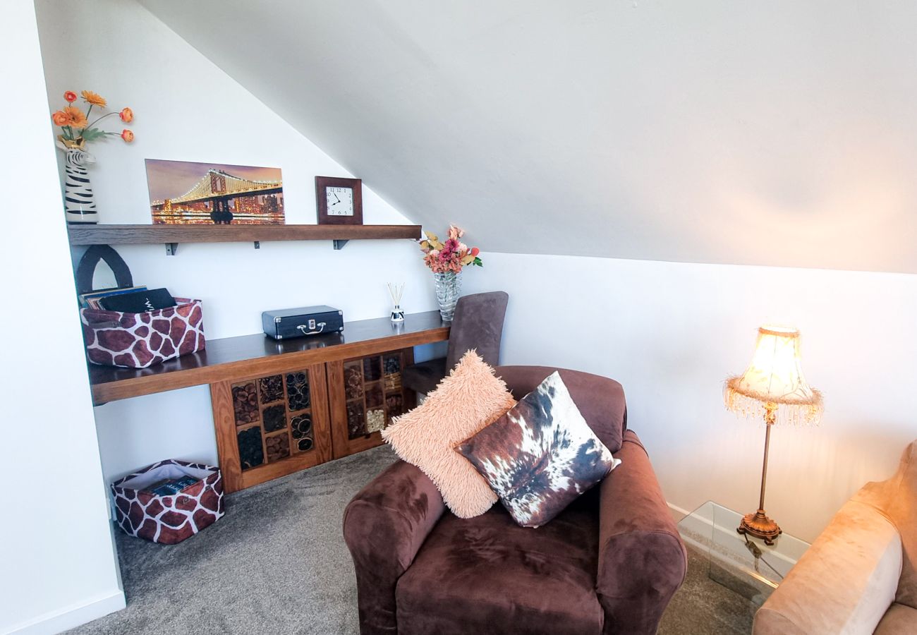 Riverrun Holiday Home No 15.  Lounge with comfortable furnishings. 