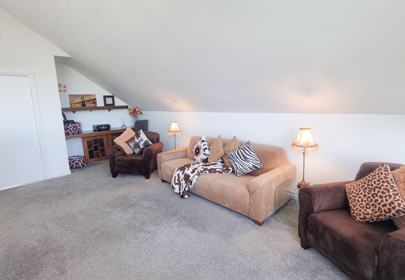 Riverrun Holiday Home No 15.  Mezzanine second lounge loft upstairs. TV sofas and large windows. 