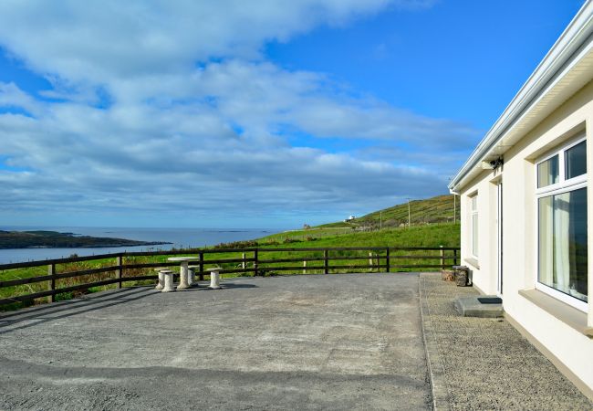 Exterior and garden of Sky Road Holiday Home located on the scenic Sky Road is a large coastal proeprty sleeping 10, close to the vibrant town of Clif