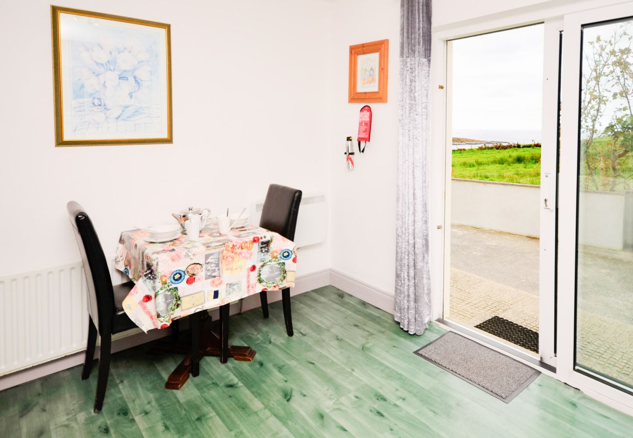 Dining Room of Sky Road Holiday Home located on the scenic Sky Road is a large coastal proeprty sleeping 10, close to the vibrant town of Clifden