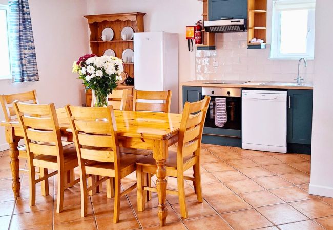 Dining Table and Kitchen at Dingle Harbour Cottages