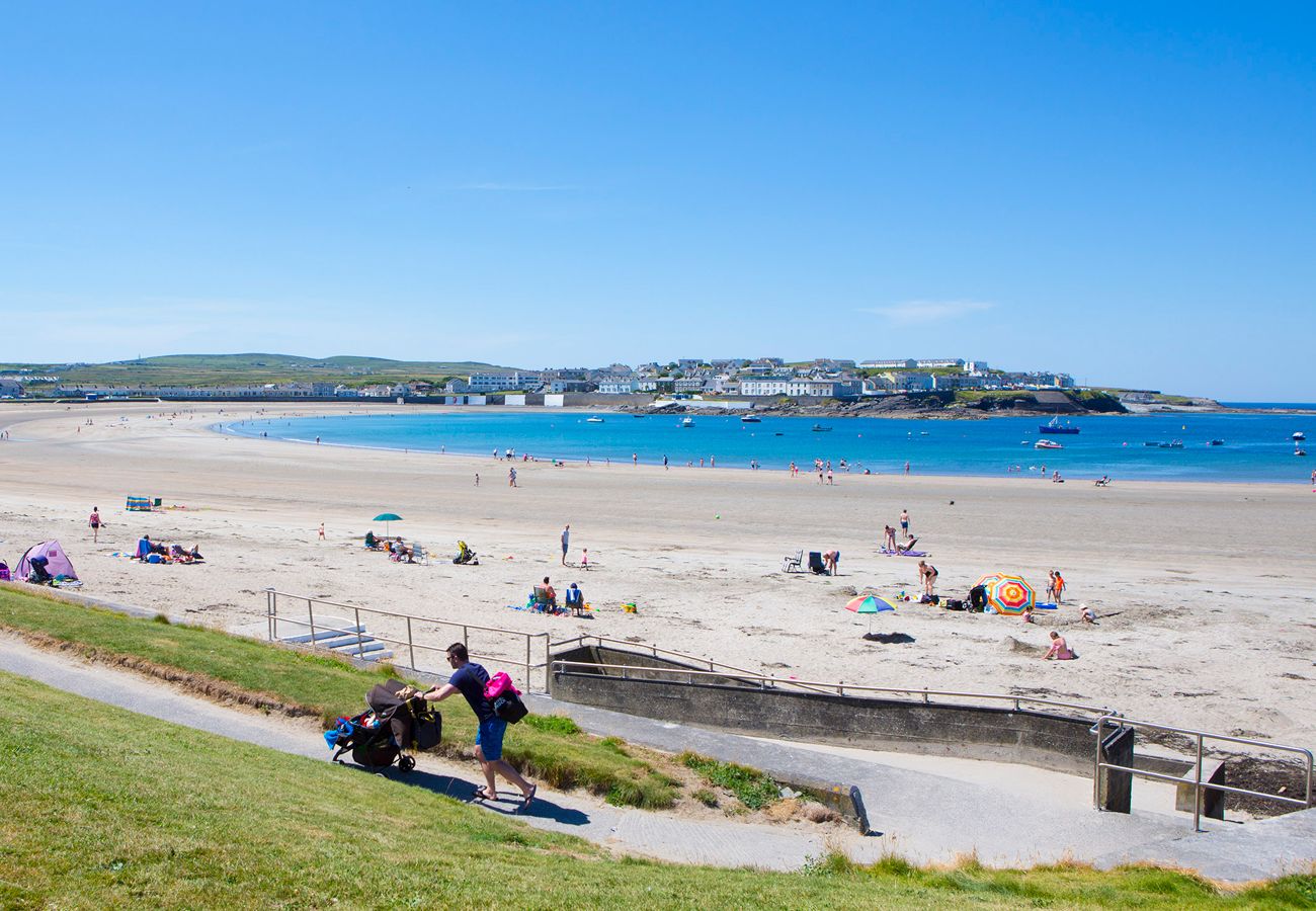 Kilkee golden sandy beach, sitting at the end of a sheltered bay in Clare, Ireland