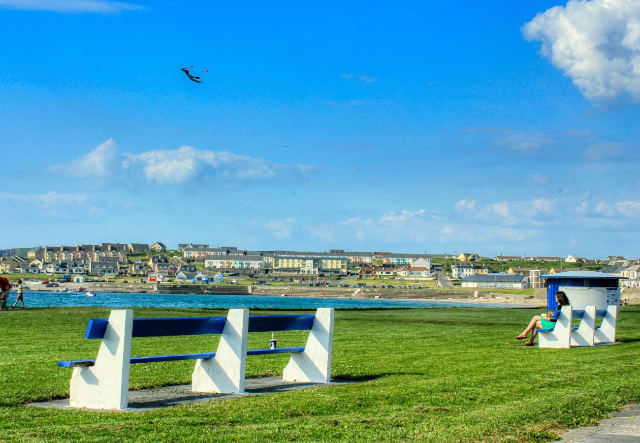 Kilkee Holiday Homes, Seaside Holiday Accommodation, Kilkee, County Clare, Ireland. Seating with view of beach, green picnic area. 