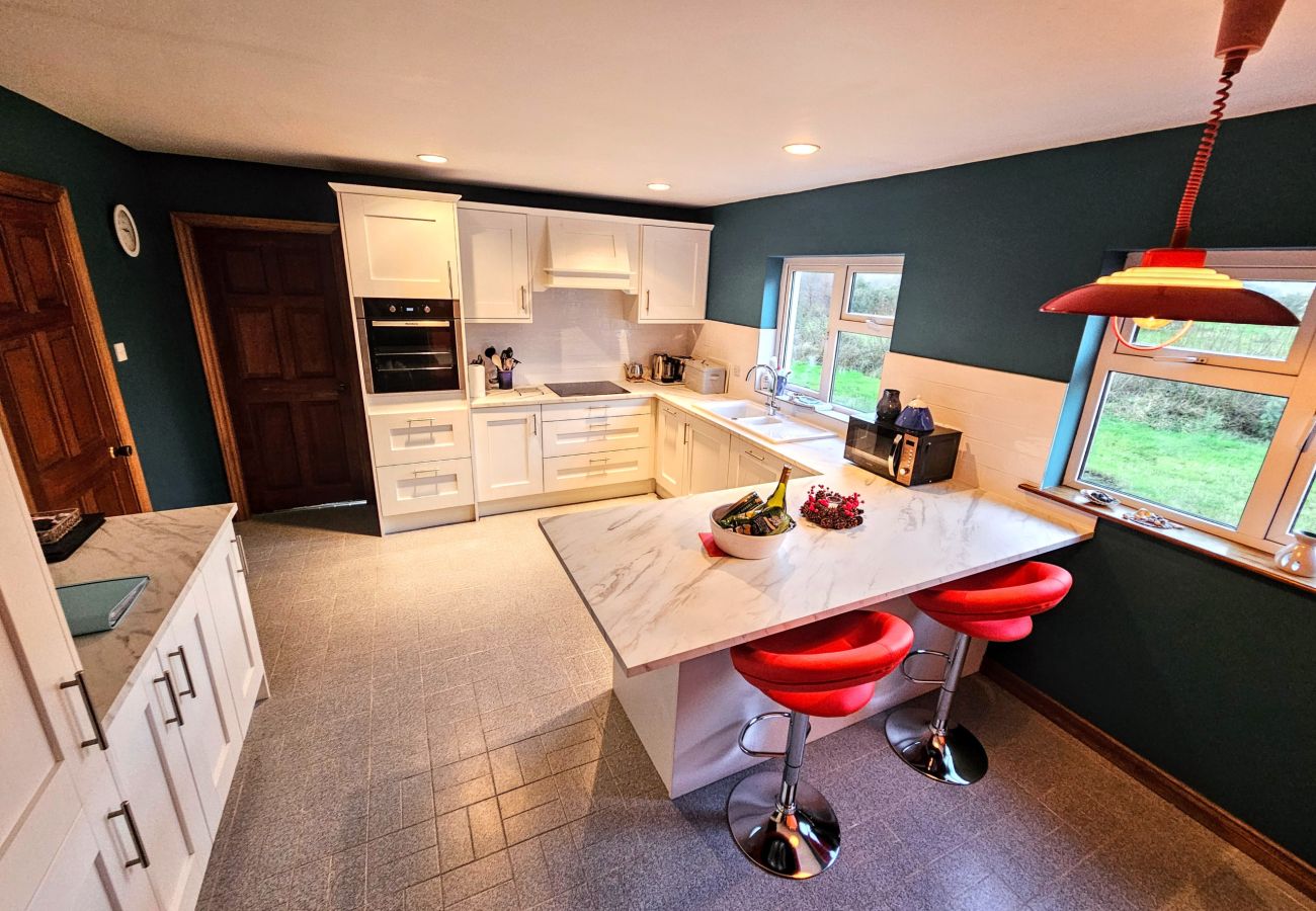 Lark Rise Holiday Home Glenbeigh. Modern Kitchen, high stools with counter. 