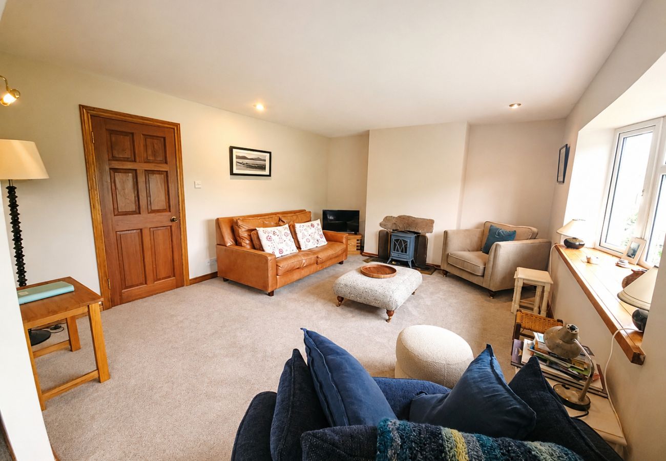 Lark Rise Holiday Home Glenbeigh. Large  bright comfortable lounge with large window. 