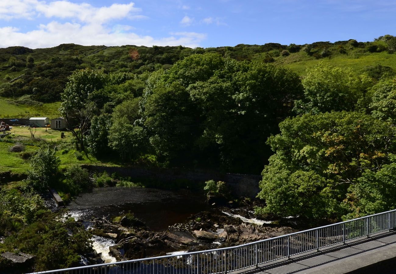 Owenglin River beside Owenglin River Holiday Home in Clifden