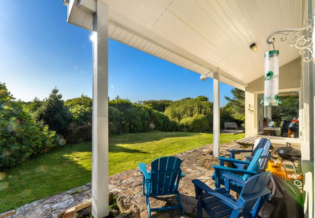 Outdoor seating areas at Clifden Countryside Holiday Home