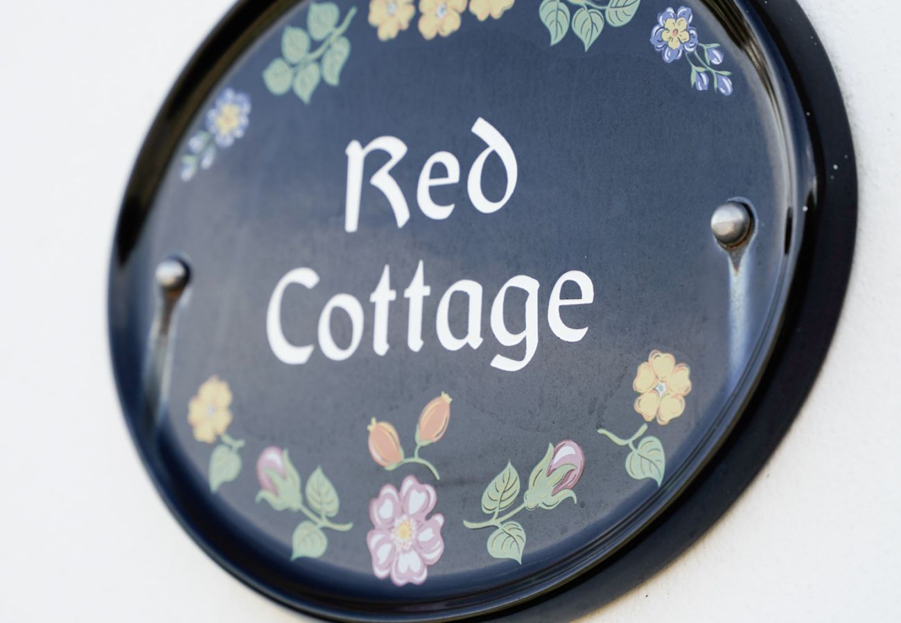  Exterior sign at The Red Stonecutters Cottage, Doolin / Doonagore, Co. Clare, Ireland 