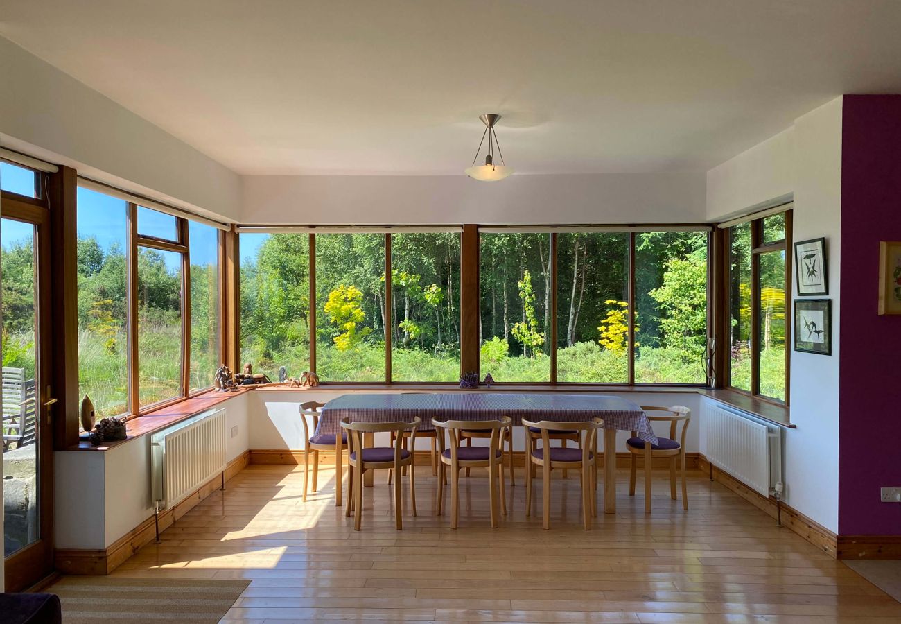 Dining room overlooking the garden at Lough Corrib Luxury Holiday Home