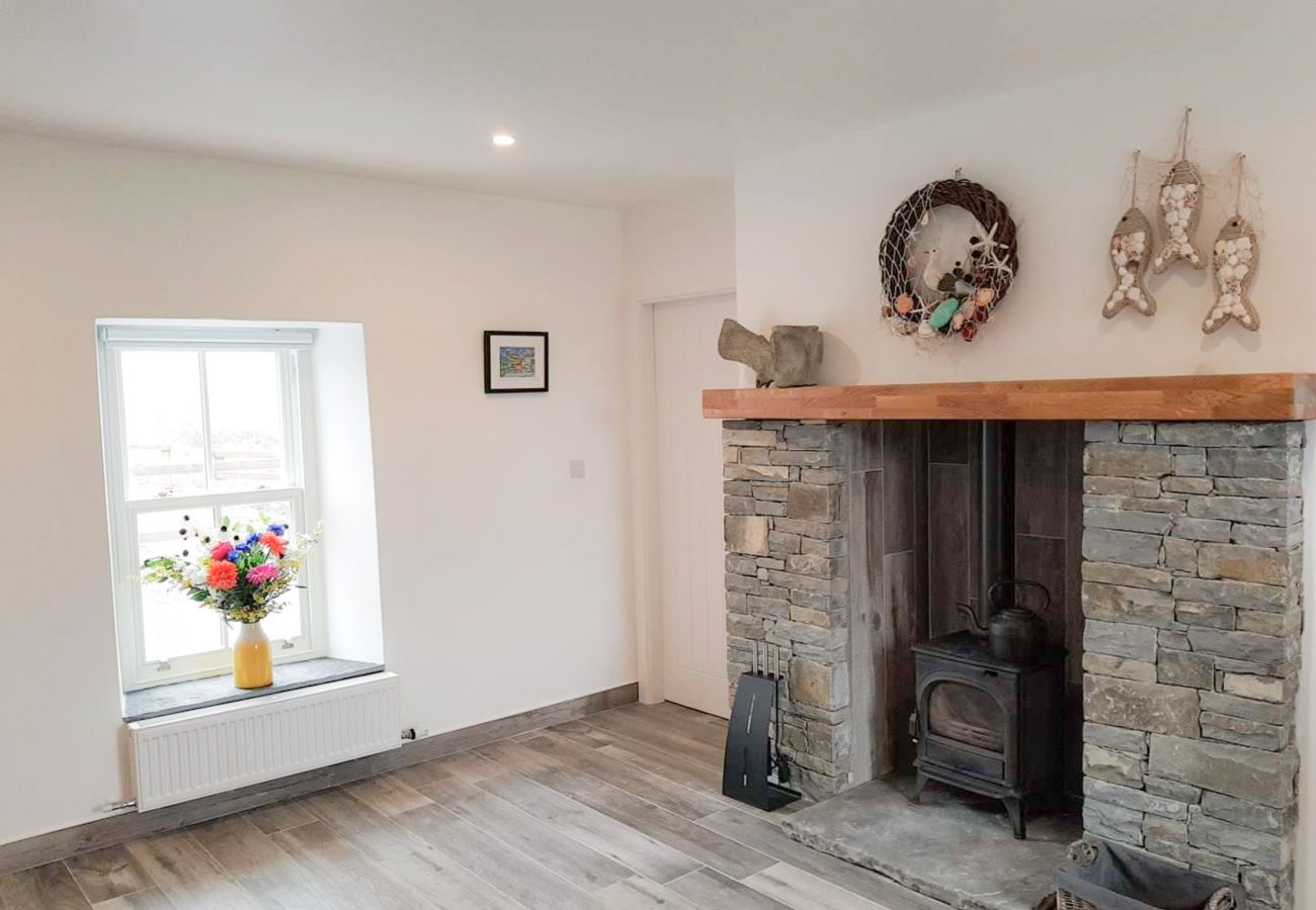 Fireplace area  at The Coral Stonecutters Cottage, Doolin / Doonagore, Co. Clare, Ireland 