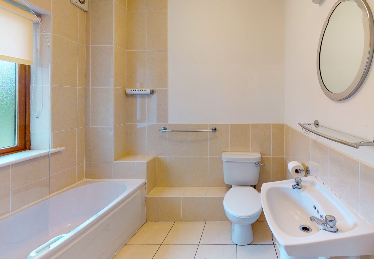 Bathroom with bath at Lakeside Holiday Homes