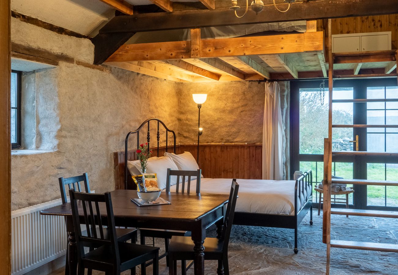 Master bedroom with Large window Ventry Farm Seaside Cottage 