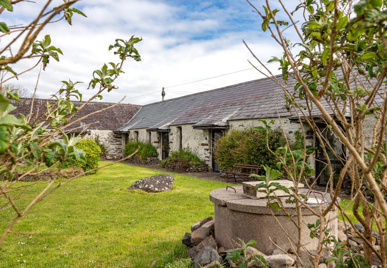 Exterior view of Ventry Farm Cottages - a cluster of rustic and charming accommodation available on Dingle Peninsula, County Kerry