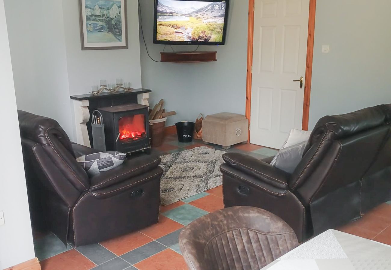 Cosy living room, open fire stove. Seamount Holiday Village No.26 , Seaside Holiday Home Available near Courtown Village, County Wexford