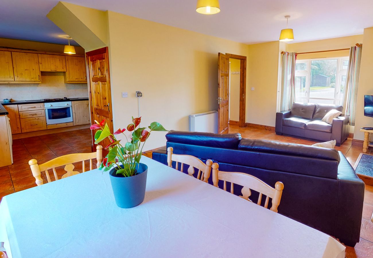 Seacliff Holiday Home No. 12. Dunmore East, County Waterford, Ireland. Dining table, open plan living room.