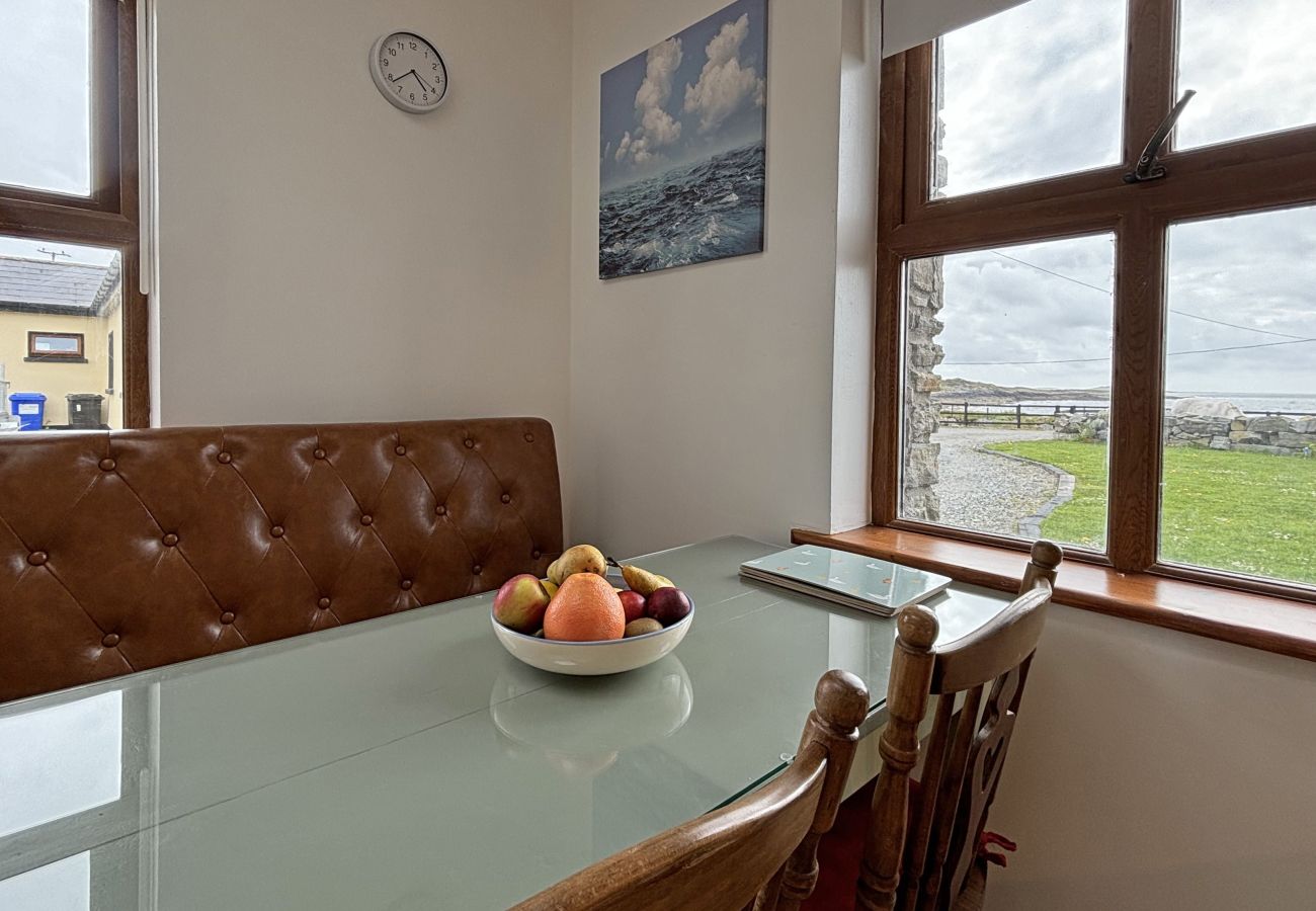 Clifden Holiday Apartment. Compact dining area, seating for 4 with beautiful views.