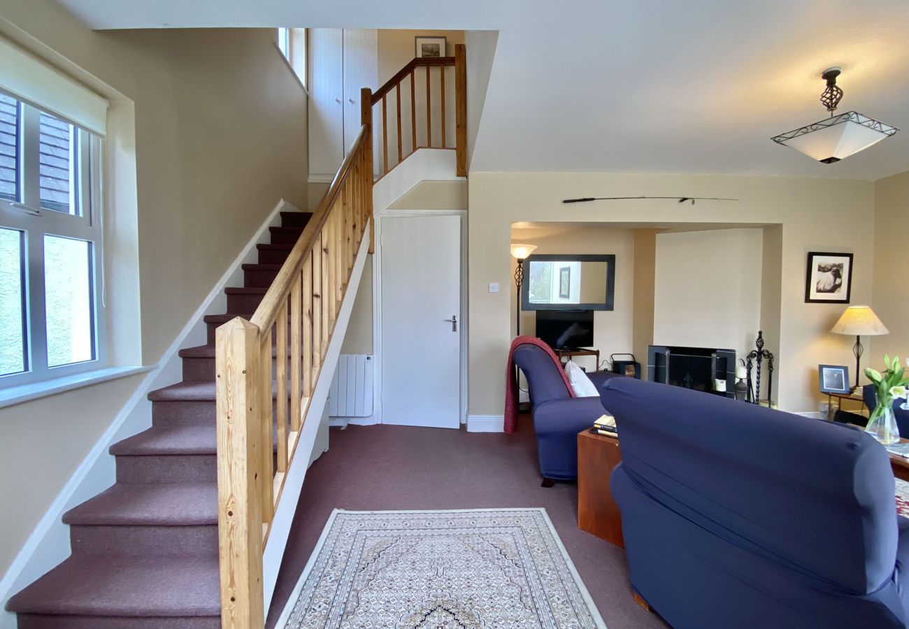 Clifden Glen Holiday Village No 30. Living room stairs. 