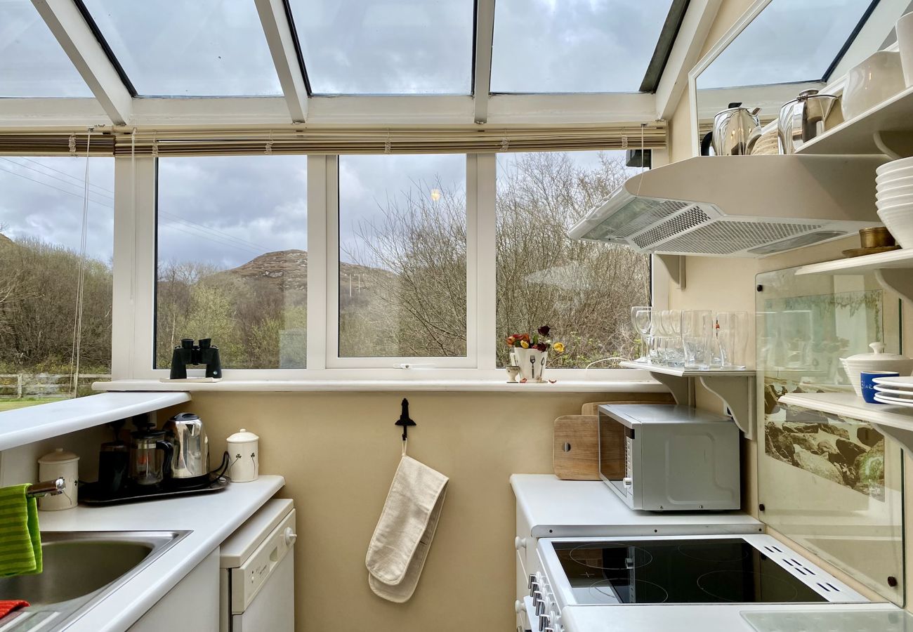 Clifden Glen Holiday Village No 30. Conservatory/kitchen open plan kitchen with counter. Views