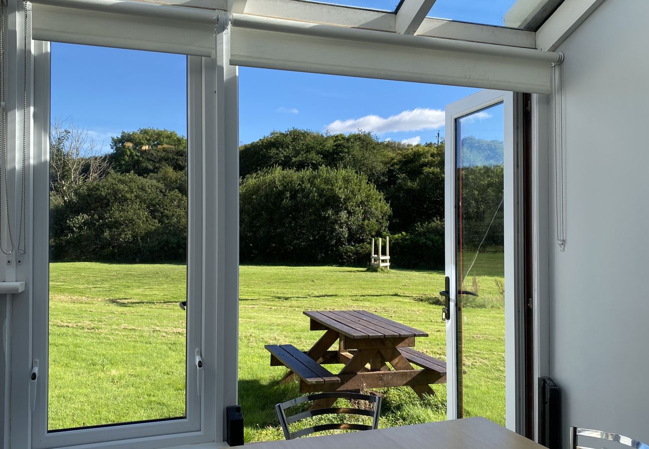 Clifden Glen Holiday Village No 58. Views to garden. access from kitchen patio doors. Outside dining. 