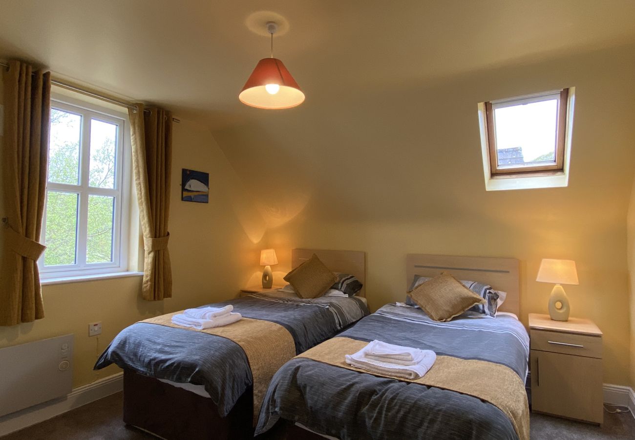 Clifden Glen Holiday Village No 11. Clifden Co Galway. Bedroom, two single beds, loft. Bright airy room. Window. 