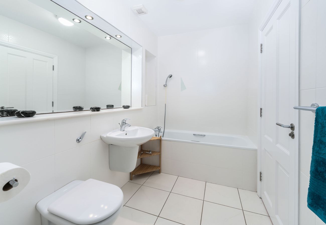 Ocean View Holiday Home. Spacious bathroom Bath, WC, sink. Tiled. 