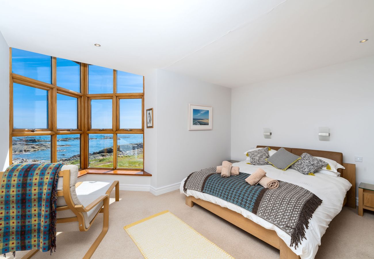 Ocean View Holiday Home. King size bed, lockers and lamps and storage. Spacious room with sea views