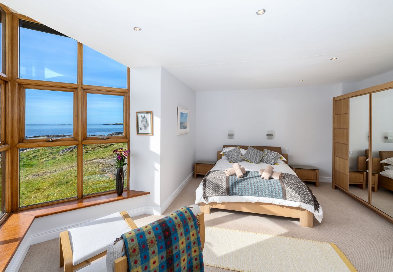 Ocean View Holiday Home. King size bed, lockers and lamps and storage. Spacious room with sea views