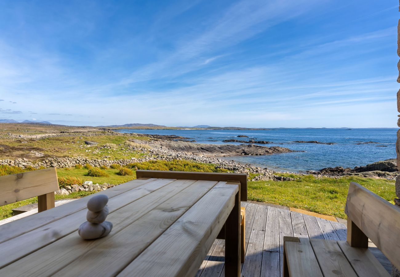 Ocean View Holiday Home. Spectacular views to the countryside and ocean. Outside furniture on decking. 