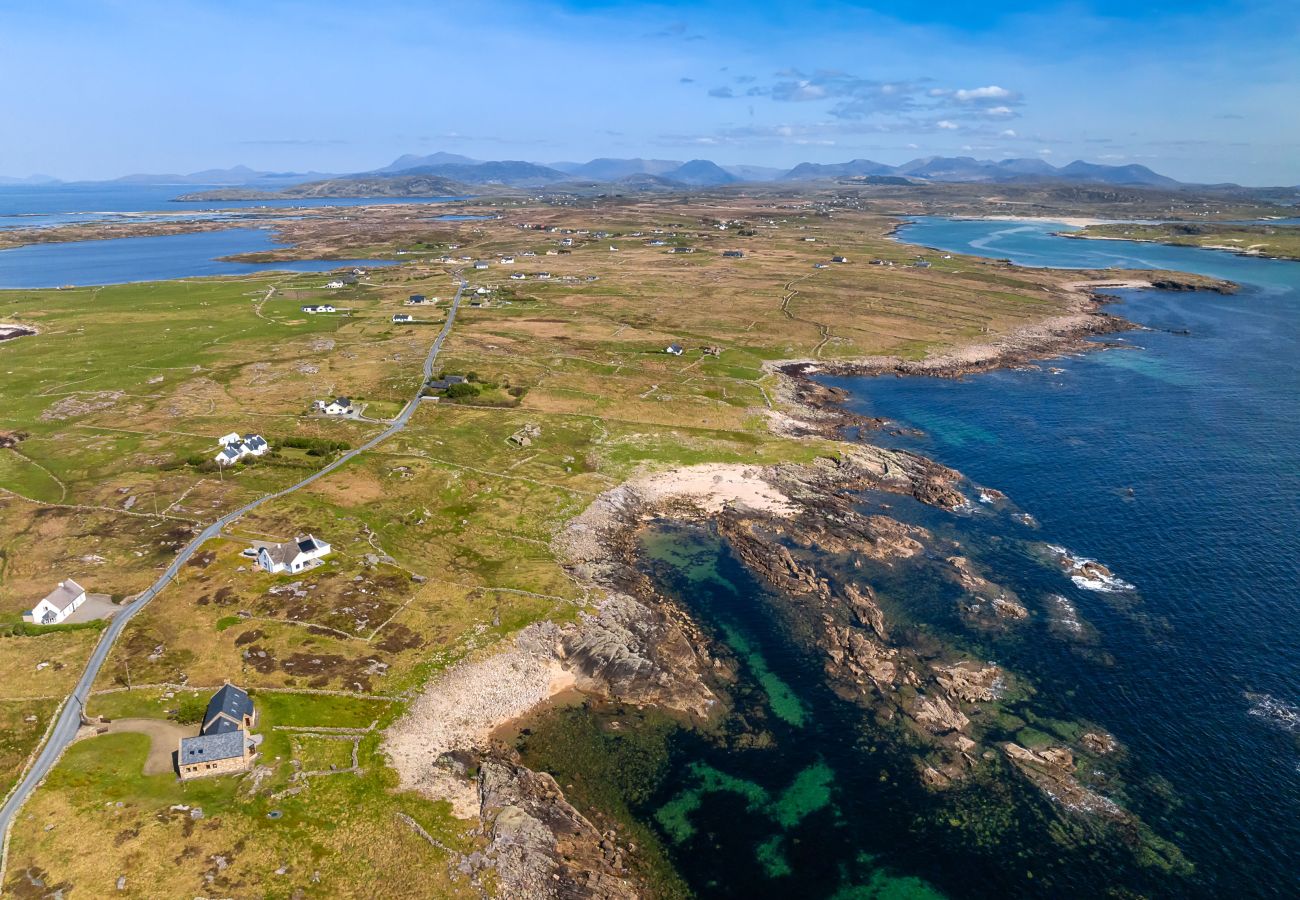 Ocean View Holiday Home. Spectacular views to the countryside and ocean. Traditional stone house. Outdoor seating. Aerial view. close to rocky beach.