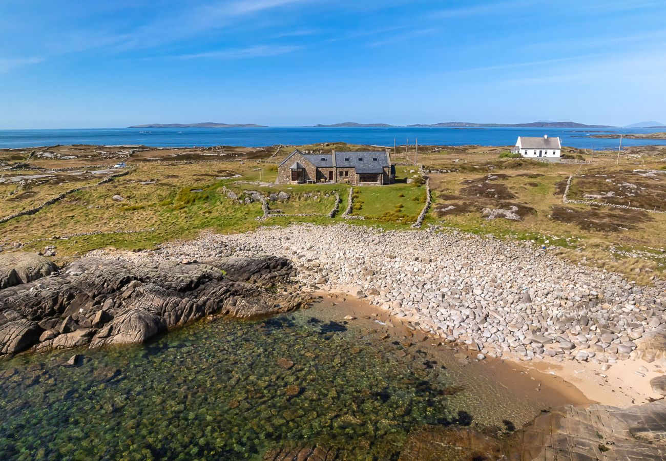 Ocean View Holiday Home. Spectacular views to the countryside and ocean. Traditional stone house. Outdoor seating. Aerial view. close to beach. 