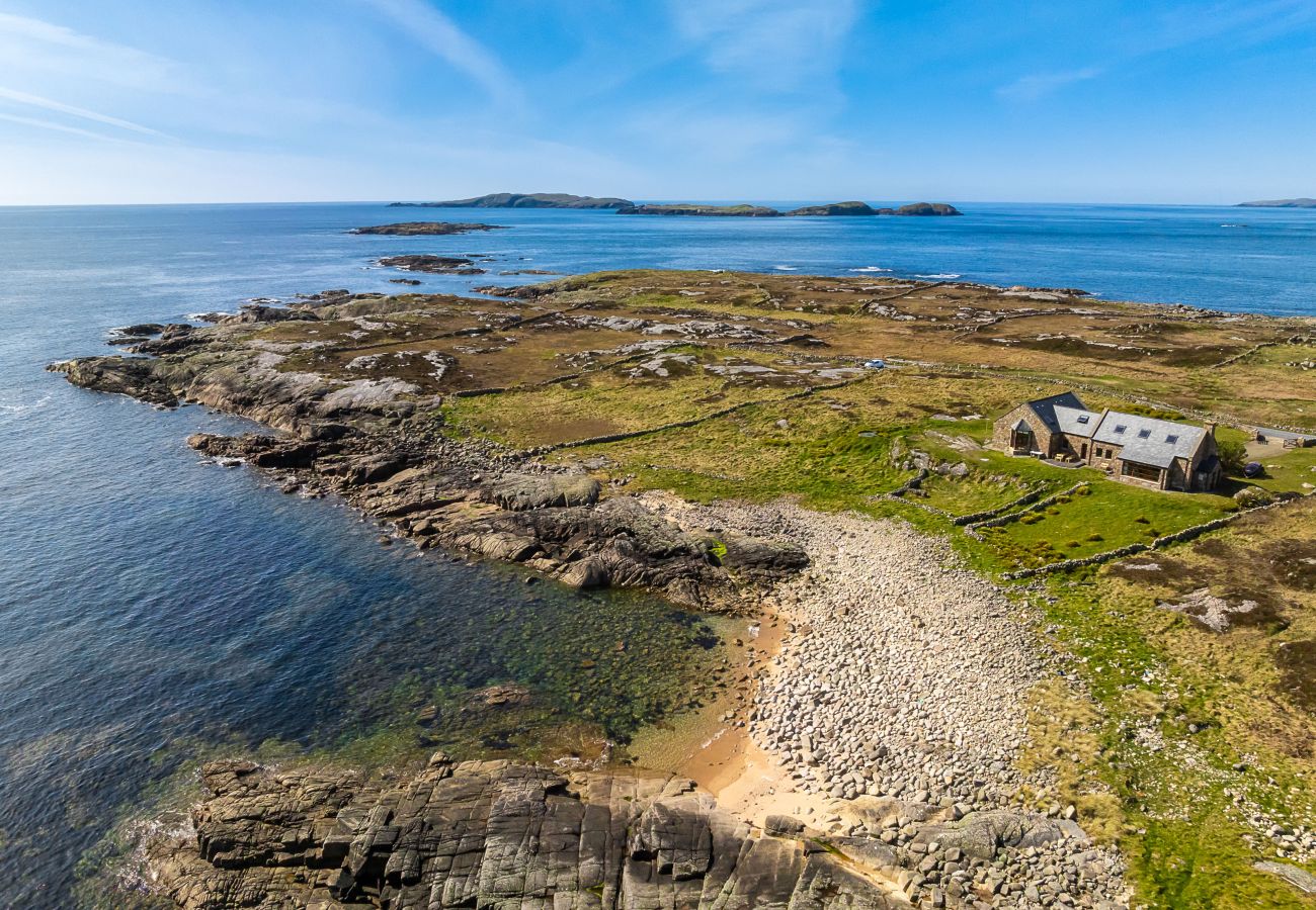 Ocean View Holiday Home. Spectacular views to the countryside and ocean. Traditional stone house. Outdoor seating. Aerial view. close to rocky beach.