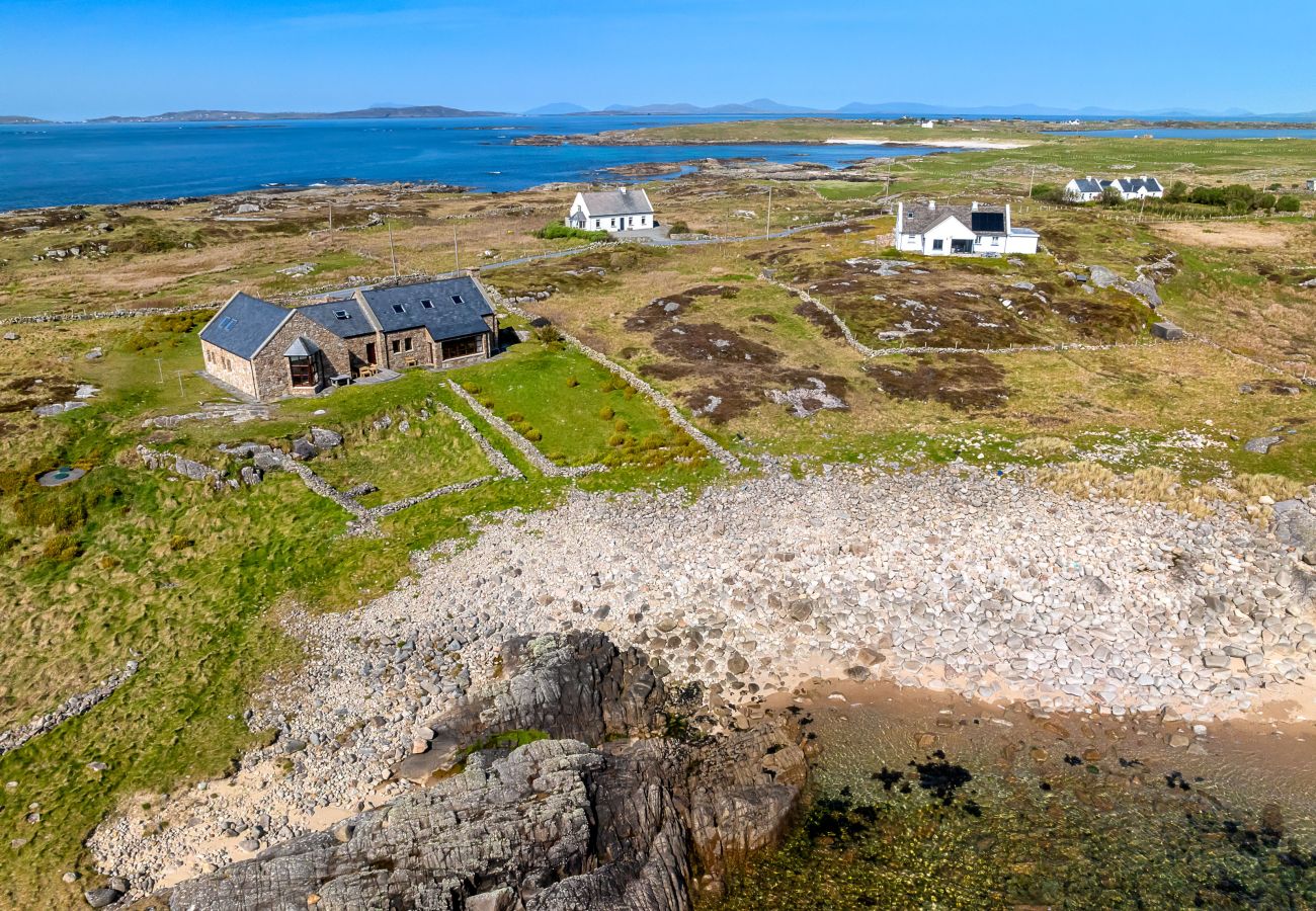 Ocean View Holiday Home. Spectacular views to the countryside and ocean. Traditional stone house. Outdoor seating. Aerial view. close to beach. 