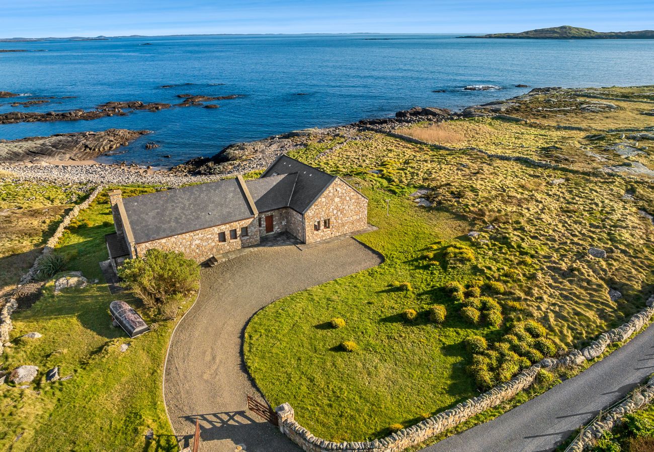 Ocean View Holiday Home. Spectacular views to the countryside and ocean. Traditional stone house. Outdoor seating. Aerial view.