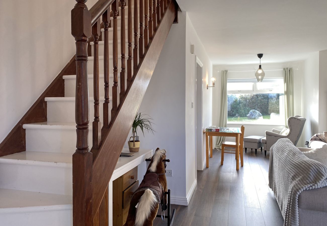 Glynsk Holiday Home. Hall and stairs, open plan into Living room, view to garden. 