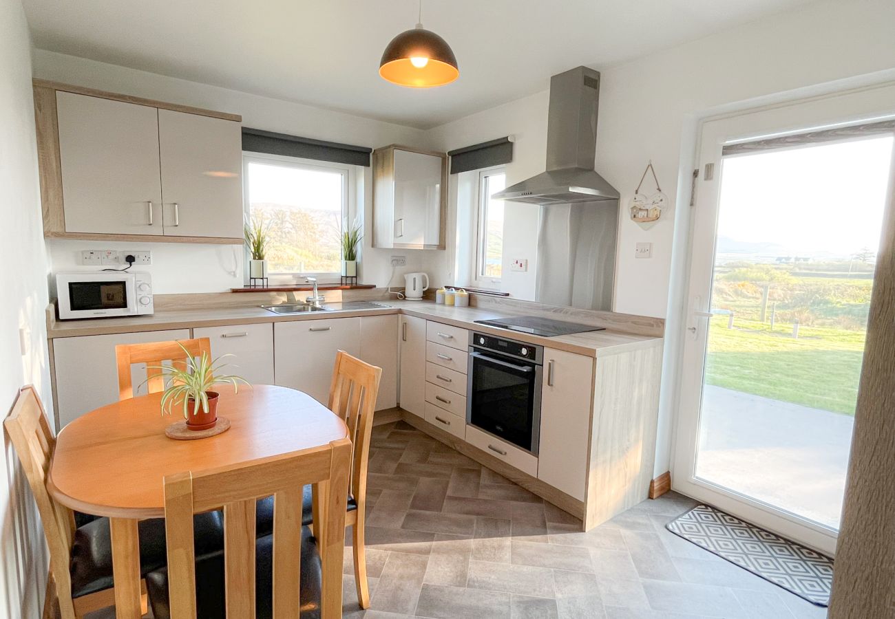 Honeybee Cottage Valentia Co Kerry.  Bright kitchen with views to garden. 