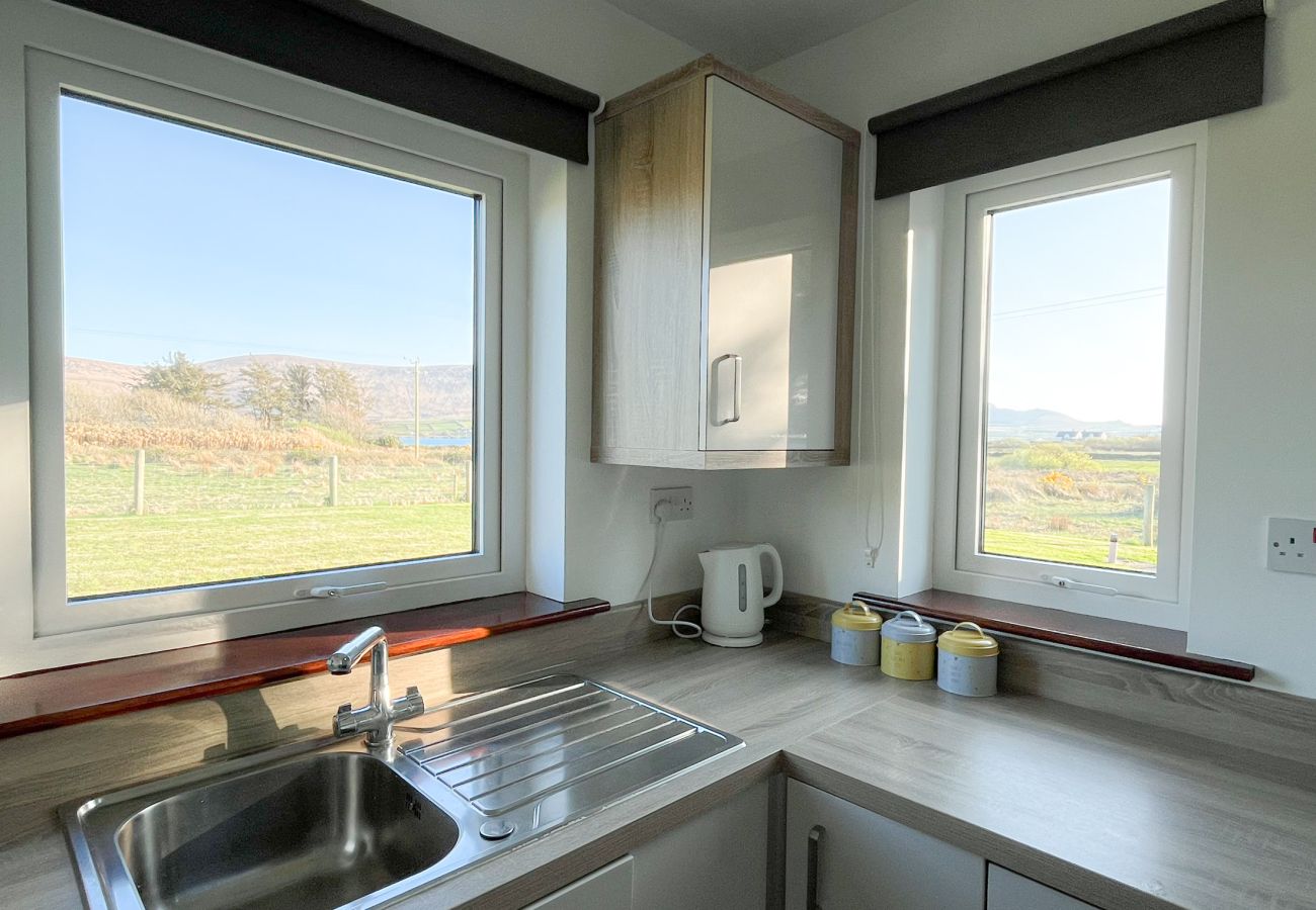 Honeybee Cottage Valentia Co Kerry.  Bright kitchen with views to garden. 