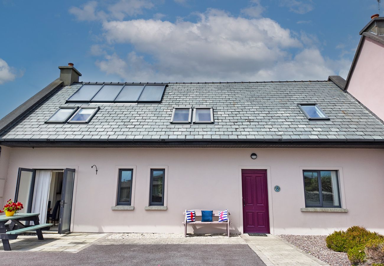 Derrynane Oceancove Holiday Homes Co Kerry. Family holiday accommodation. Exterior with seating and sea views. 