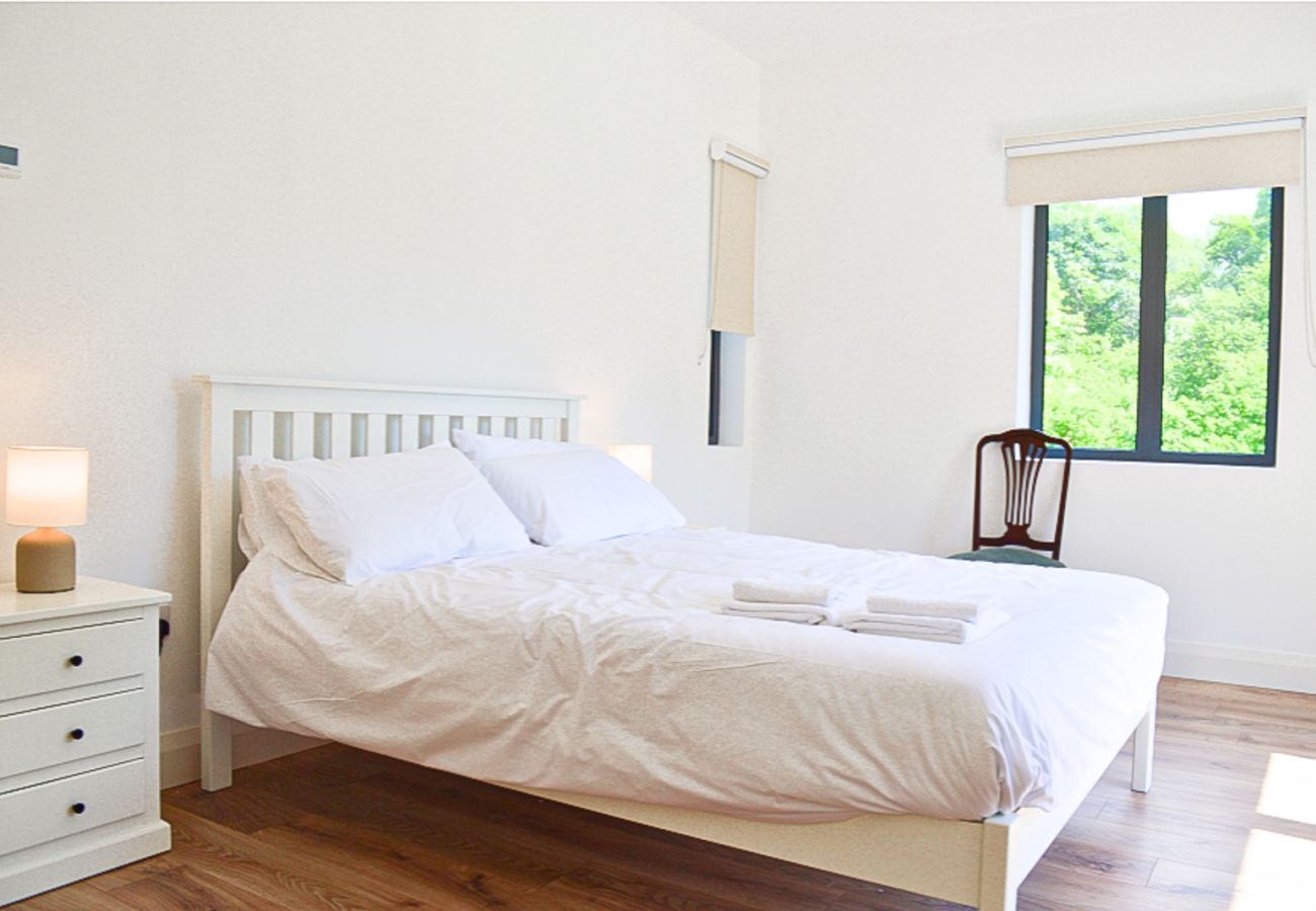 Lough Conn Haven Holiday Home. Bright modern double room with wooden floors. En suite.