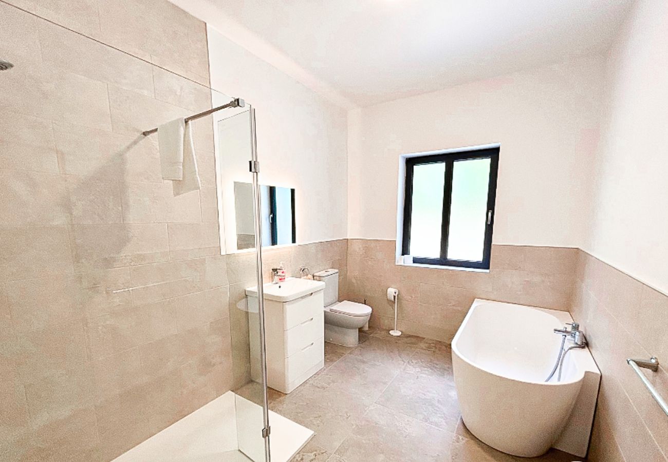 Lough Conn Haven Holiday Home. Bright modern stylish family bathroom with bath, hand basin and WC.