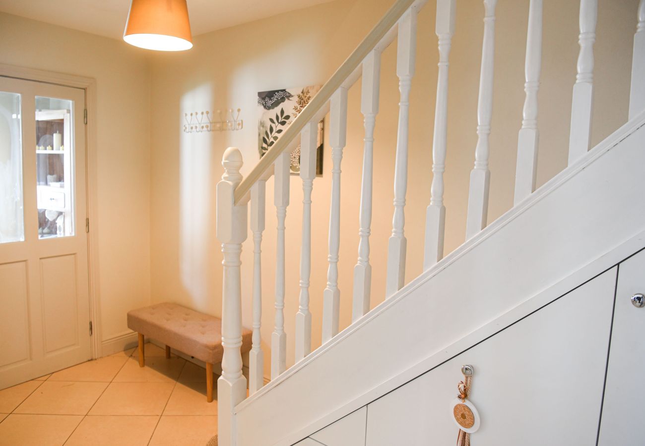 Skellig Fuchsia Lodge Ballinskelligs. Bright holiday home hall and stairs. 