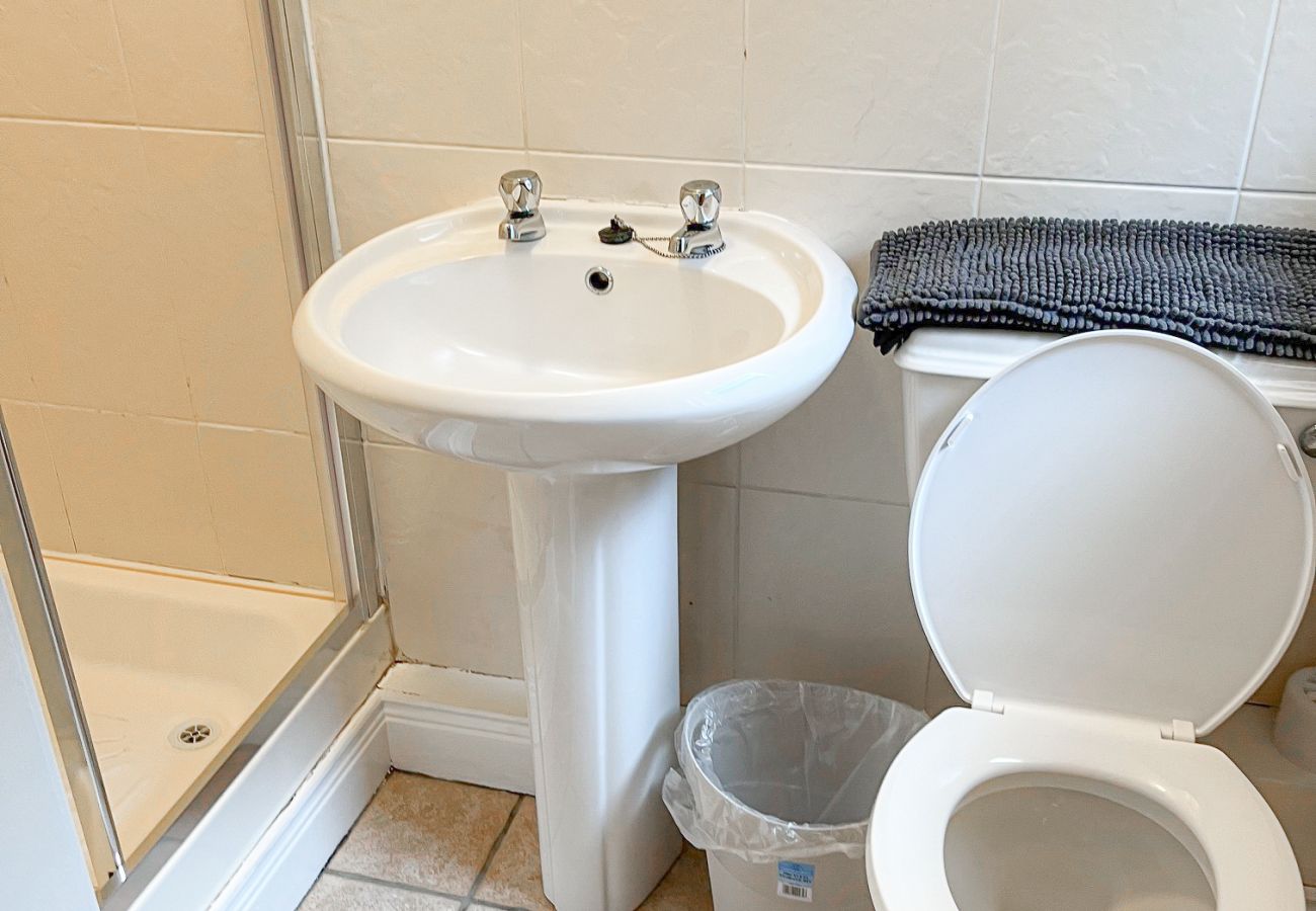 Fishermans Grove Holiday Home No. 21. Bathroom  Fishermans Grove Holiday Home No. 21. Bathroom compact, bright WC and sink and shower.