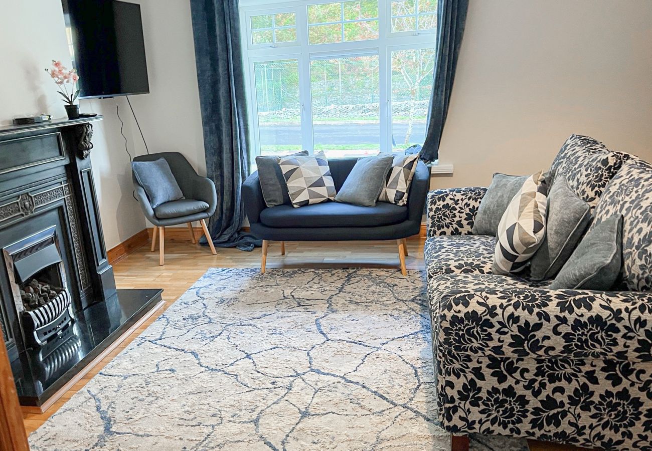 Fishermans Grove Holiday Home No. 21. Living and TV room.  Fishermans Grove Holiday Home No. 21. Living and TV room. Bright, modern comfortable seating, large window, cosy fireplace.