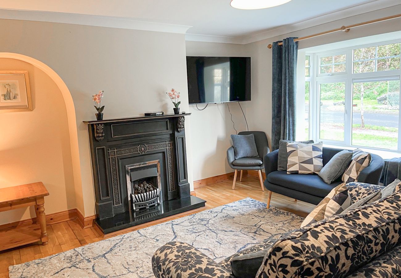 Fishermans Grove Holiday Home No. 21. Living and TV room Fishermans Grove Holiday Home No. 21. Living and TV room, comfortable sofa and cosy fireplace.