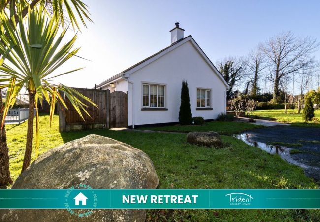 Brittas Bay Holiday Park No 7. Sunny exterior with large green area and spacious setting. 